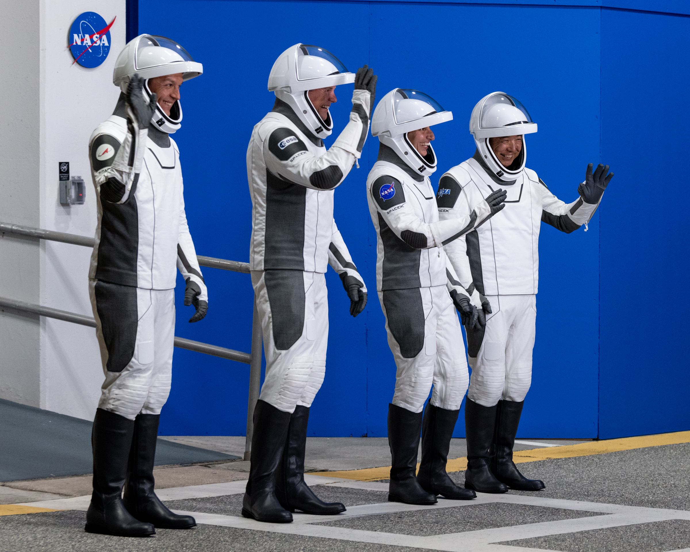 Suited up and ready to fly, Crew-7 walks out of the Neil Armstrong Operations & Checkout Building. They will say goodbye to colleagues and family at this time.